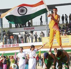 A schoolboy waves the national flag as part of a function to mark Republic Day at Guru Nanak Stadium in Amritsar on Saturday.
