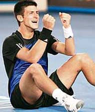 Serbian player Novak Djokovic gestures as he celebrates victory in mens singles final against French opponent Jo-Wilfried Tsonga at the Australian Open