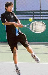 Pankaj in action during boys under-14 category of AITA championship series at Lake Sports Complex in Chandigarh on Monday.