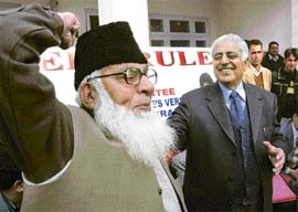 Former chief minister Mufti Mohammed Sayeed looks at a supporter in Jammu office of the Peoples Democratic Party on Monday.