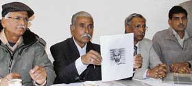 Ludhiana Transporters Welfare Association chairman Prithviraj Sharma addresses mediapersons in Ludhiana on Monday. 