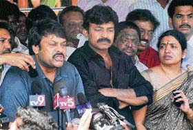Telugu superstar Chiranjeevi (left) speaks to the media as actor Rajasekhar and his wife Jeevita look on in Hyderabad
