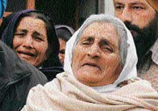 The mother of Kalsi brothers at their cremation in Patiala on Monday. 
