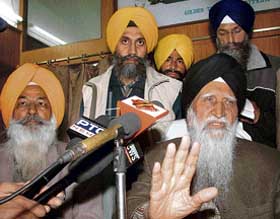Sikh intellectuals Suba Singh (left) and Kharak Singh (right) address mediapersons in the SGPC complex in Amritsar on Monday. 