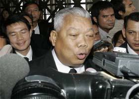 Samak Sundaravej, leader of the People's Power Party, talks to reporters as he leaves parliament after being voted as the Thailands new prime minister in Bangkok