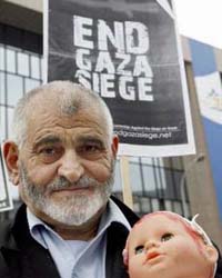 A man protests against the Israeli siege on Gaza in front of the European Union headquarters in Brussels