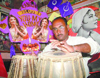 Kite-maker Jagmohan Kanojia plays tabla at his house in Amritsar.