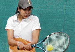 A player hits a shot during the AITA Championship at Lake Club in Chandigarh on Tuesday
