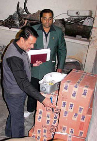 A councillor counts the boxes of the controversial sodium lamps at MC office in Ambala on Wednesday. 