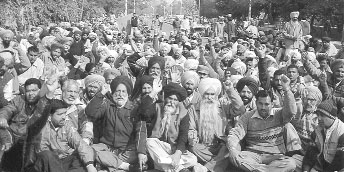 Members of the Punjab State Karamchari Dal sit on a dharna in support of their demands in Patiala on Wednesday. 