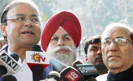Senior BJP leaders Arun Jaitley (left), Vijay Kumar Malhotra and S.S. Ahluwalia talk to mediapersons at Nirvachan Sadan after submitting a petition to remove Election Commissioner Navin Chawla in New Delhi on Wednesday.