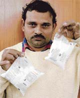 Sector 23 resident Om Prakash (left) shows a 400 ml milk packet of milkfed which he bought from a Verka booth in Sector 23, Chandigarh. It was sold to him as a 500 ml pack. With the underweight packet he has decided to approach the Weight and Measures Department to complain about the matter