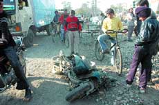 The damaged two-wheeler which got entangled with a bumper of the mini-truck in Jalandhar on Friday. 