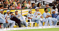 Indian players look on from the bench as their team is dismissed cheaply during the Twenty20 match at the MCG in Melbourne on Friday. India were all out for 74 in 17.3 overs eventually losing the match by nine wickets.