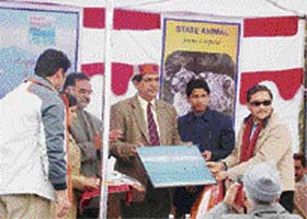 Union minister of state for environment Namo Narain Meena (wearing Himachali cap) being honoured at the national-level function on World Wetland Day at Fatehpur, near Pong Dam, in Kangra district