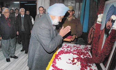 A trustee of The Tribune Trust, Justice S.S. Sodhi, pays floral tributes to Sardar Dyal Singh Majithia at the Tribune Office, Chandigarh, on Saturday.