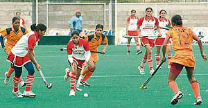 A match between Punjab and Uttar Pradesh in progress during the 55th Rakshak Senior Womens National Hockey Championship in Jalandhar on Saturday.