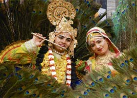 Artistes dressed as Lord Krishna and Radha enact rasleela at the Surajkund Crafts Mela in Faridabad
