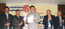 State president of the BJP Rajinder Bhandari releases the news letter of Ludhiana Architects Association in Ludhiana on Sunday.