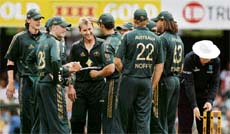 Paceman Brett Lee is congratulated by his teammates after dismissing Sachin Tendulkar during the first tri-series one-day match at the Gabba in Brisbane on Sunday. Lee with 5 for 27 was the main destroyer for the Australians.