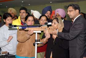 Punjab Education Minister Upinderjit Kaur tries to aim it right at the International Badal Shooting Range in Badal village of Muktsar district on Monday. 