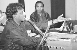 Punjabi singer Saber Koti performs during a function held by Mehak Cultural Forum at the Central State Library in Patiala