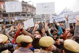Teachers from all across the state hold a protest demonstration, pressing for their demands of being given permanent posts in the teaching department, in Jammu on Monday.