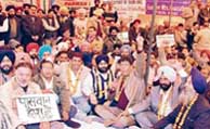 Industrialists protest against soaring steel prices in Ludhiana on Monday.