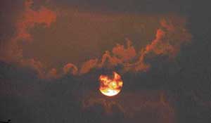 Sun peeps through the clouds that hovered over the skyline in Ludhiana on Tuesday.