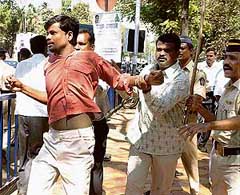 Police detains activists of the Uttar Bharatiya Sabha during their protest outside the residence of Raj Thackeray at Dadar in Mumbai on Tuesday.