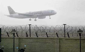 A plane lands at the airport in New Delhi