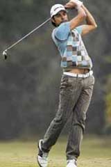 Jyoti Randhawa drives the ball on the 18th hole in the first round of the Indian Masters European Tour golf tournament in New Delhi on Thursday.