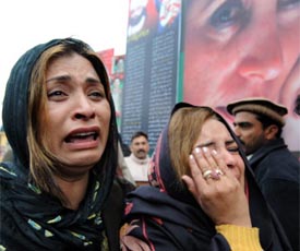 Mourners express grief as they visit the site where Opposition leader Benazir Bhutto was killed in Rawalpindi to mark the end of the 40-day mourning of Bhutto on Thursday.