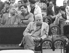 CAUGHT: Chief town planner of Punjab Rajinder Sharma takes a nap during an auction in Mohali on Friday.