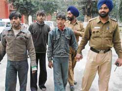 Three members of a gang of vehicle thieves at the Sector 34 police station in Chandigarh on Friday.