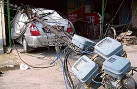 An electric pole, which was rusted at the bottom, collapsed in the Kath Mandi area of Hisar on Friday, damaging a car. 
