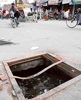 An uncovered manhole near Sanatan Dharam Temple on the Kunjpura road in Karnal on Friday which poses a danger to road users. 