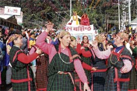 A procession being taken out by mahila mandals of remote villages of Kullu valley on The Mall in Manali