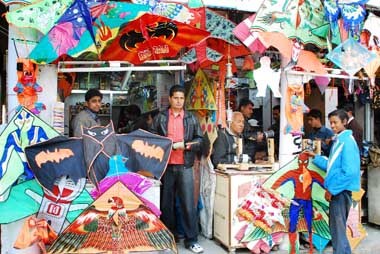 People buying kites of different hues and shapes at a shop in Bathinda on Sunday.