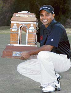 Shivshankar Chowrasia poses with the winners trophy after winning the Indian Masters European Tour golf tournament in New Delhi