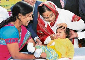 President Pratibha Patil administers polio drops to a child at a Pulse Polio camp in Jalgaon