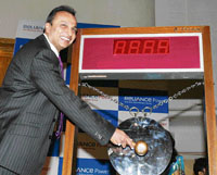 Reliance Power chairman Anil Ambani sounds a gong at a ceremony to mark the listing of the company at the Bombay Stock Exchange in Mumbai on Monday.