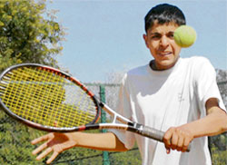 Amit of Jassowal Academy returns a shot during the 1st round of AITA talent series at CLTA in Chandigarh