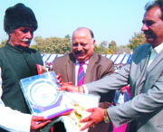 Kanwar Singh Tanwar of the Narayani Devi Charitable Trust and Lt Gen Shantanu Chaudhary honour soldiers during the sainik samman samaroh organised by the trust in the Capital on Monday.