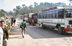 Buses and trucks stranded on the national highway No 20 near Kotla on Monday afternoon. 