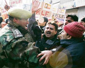 Police arrests activists of the Jammu and Kashmir Liberation Front (JKLF), during a demonstration to mark the 24th death anniversary of JKLFs founder, Maqbool Bhat, in Srinagar