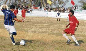 A football match in progress at Mehma Singh Wala near Ahmedgarh on Monday. 