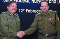 Y.S. Dadwal, Commissioner of Police of Delhi, shakes hands with R.S.Dalal, DGP of Haryana, at the Interstate Police Co-ordination Meeting in the Capital on Tuesday.