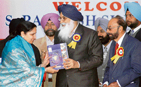 Punjab Chief Minister Parkash Singh Badal and KCW principal Varinder Kaur Thind release the souvenir of Khalsa Dewan in Ludhiana on Tuesday.