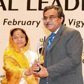 Dipendra Manocha, director, IT National Association for the Blind, receives the Lakshmipat Singhania IIM Lucknow national leadership award (science and technology) from President Pratibha Patil at a function in New Delhi